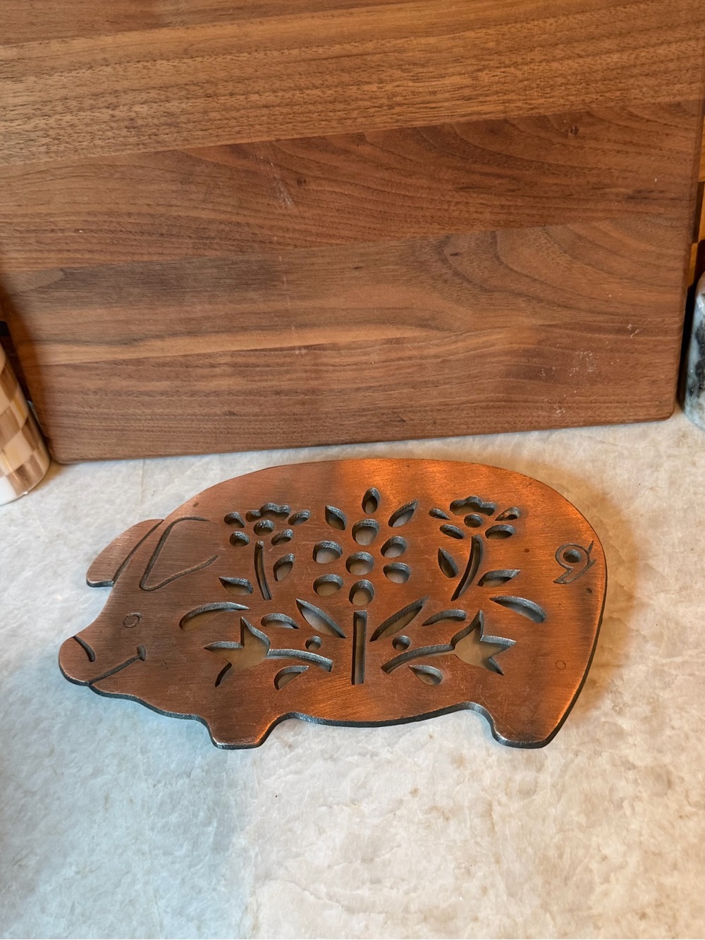 Vintage copper-plated cast iron pig trivet